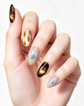 Mocha Starlight — press-on nails worn on hand, close view