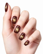 Black Cherry Cat-Eye — press-on nails worn on hand, close view