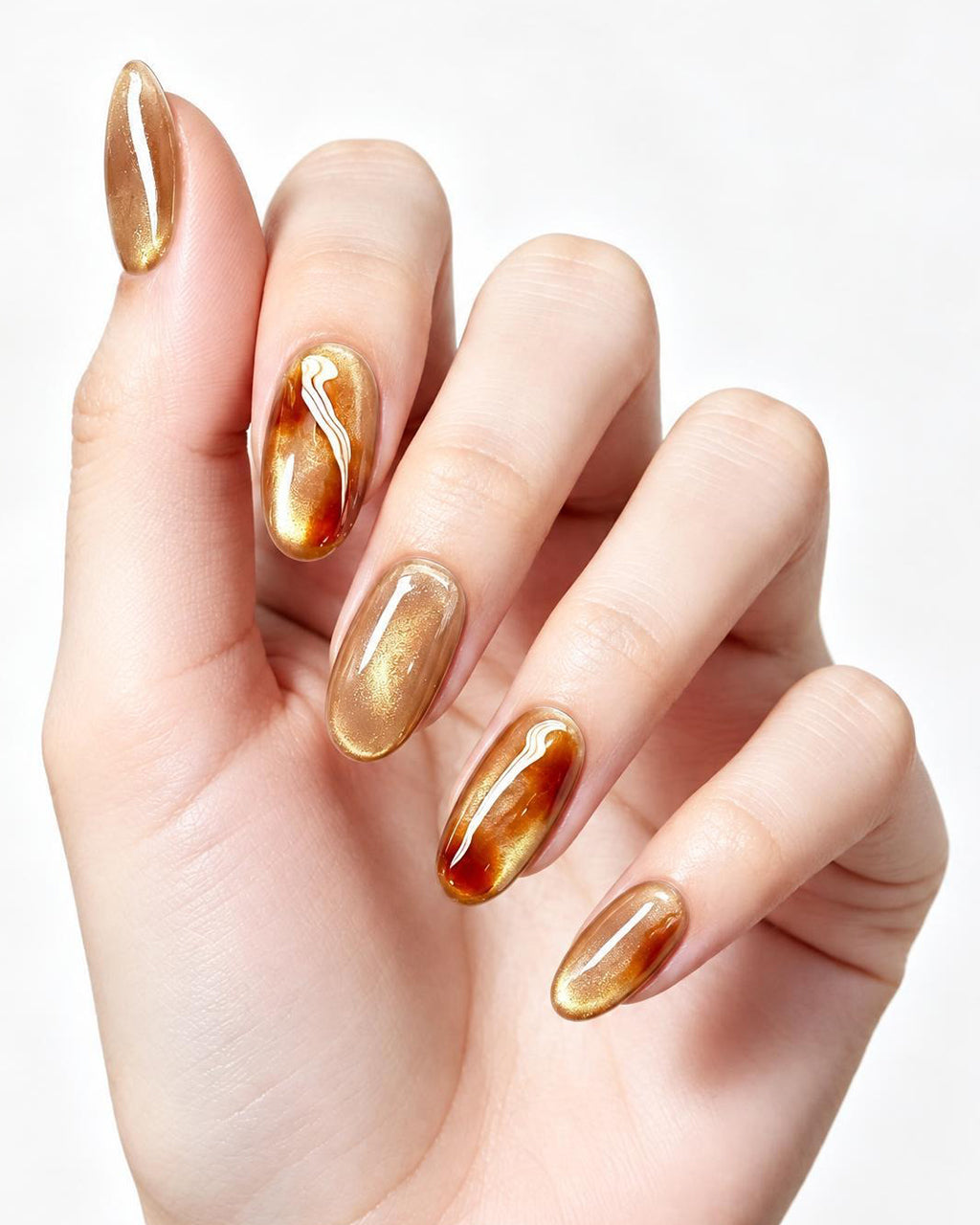 Golden Amber — press-on nails worn on hand, close view