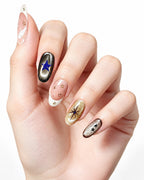 Golden Cat-Eye Star French Nails — press-on nails worn on hand, close view