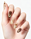 Mocha Starlet — press-on nails worn on hand, close view