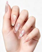 Pink Nebula — press-on nails worn on hand, close view