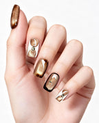 Golden Mocha Cat-Eye — press-on nails worn on hand, close view