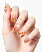Honey Glow Amber Gem Jelly Nails — press-on nails worn on hand, close view
