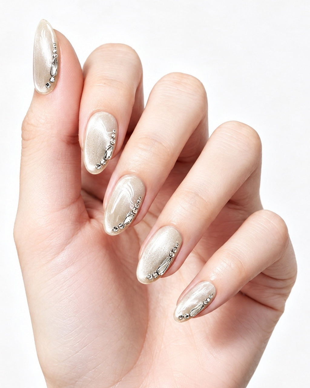Silver Cat-Eye Crystal Chrome Nails — press-on nails worn on hand, close view