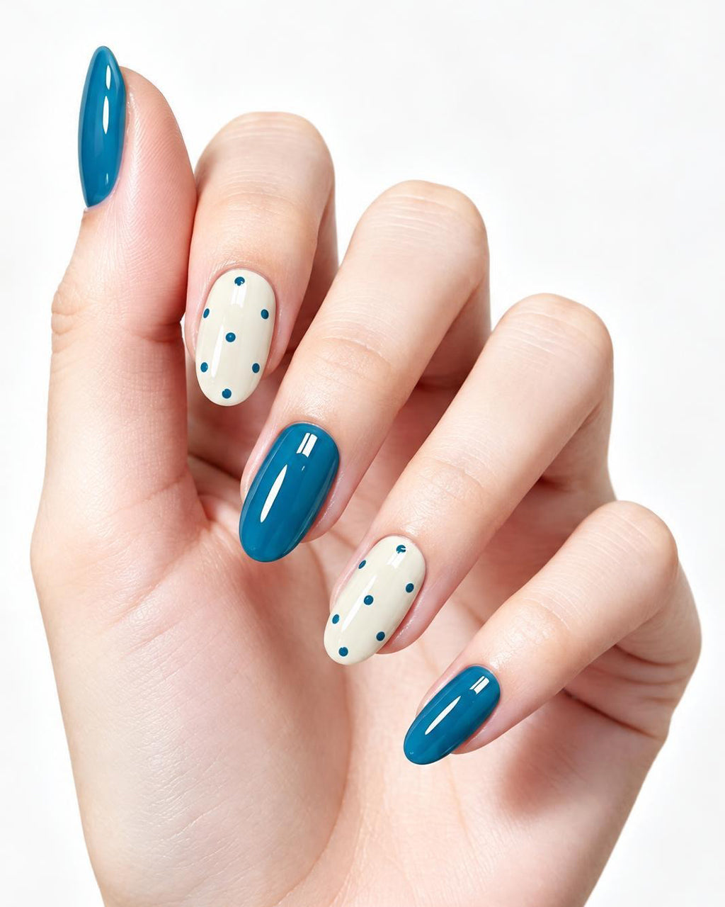 Teal Blue & Polka Dot — press-on nails worn on hand, close view