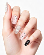 Parisian Girl | Pink & Black Polka Dot Handmade — press-on nails worn on hand, close view