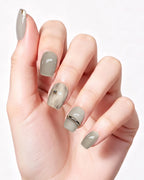 Minimalist Gray — press-on nails worn on hand, close view
