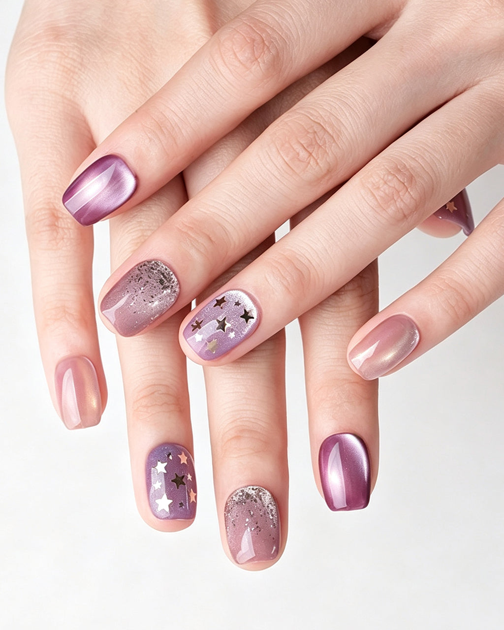 Dusty Rose Cat Eye — press-on nails worn on hand, close view
