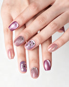 Dusty Rose Cat Eye — press-on nails worn on hand, close view