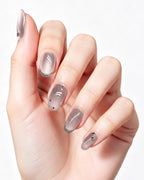 Mist Shrouds Camellia — press-on nails worn on hand, close view