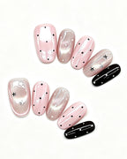 Parisian Girl | Pink & Black Polka Dot Handmade — press-on nail set, full set, styled arrangement