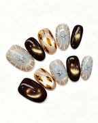 Mocha Starlight — gold press-on nail set, full set, styled arrangement