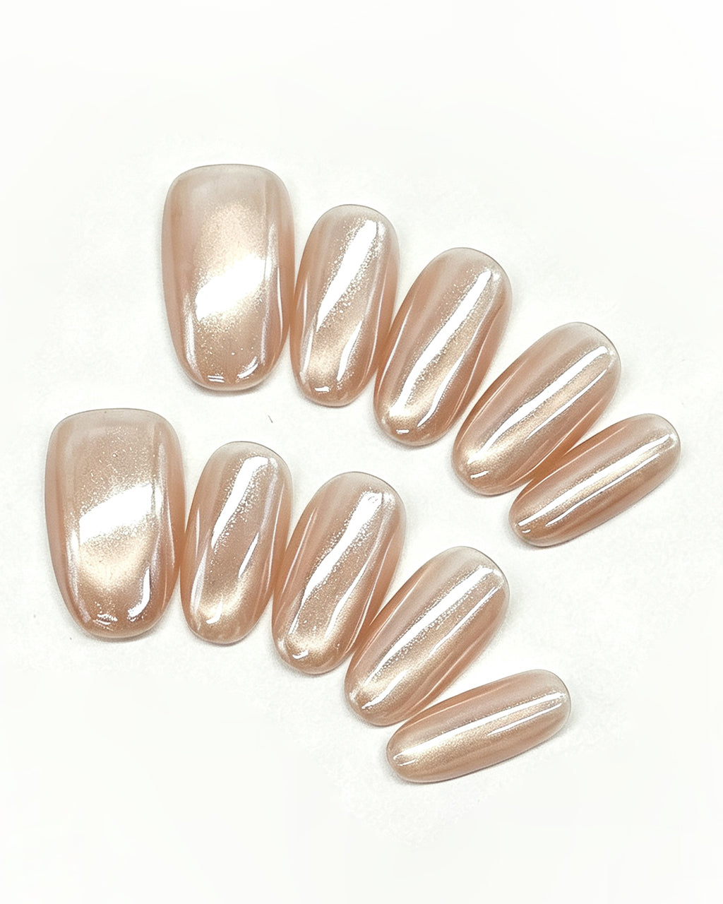Champagne Glazed Pearl — gold press-on nail set, full set, styled arrangement
