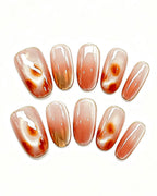 Honey Glow Amber Gem Jelly Nails — gold press-on nail set, full set, styled arrangement