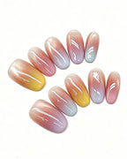 Sunset Mirage — pink press-on nail set, full set, styled arrangement