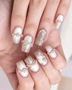Afloat — press-on nails worn on hand, close view