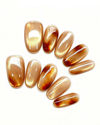 Golden Amber — gold press-on nail set, full set, styled arrangement