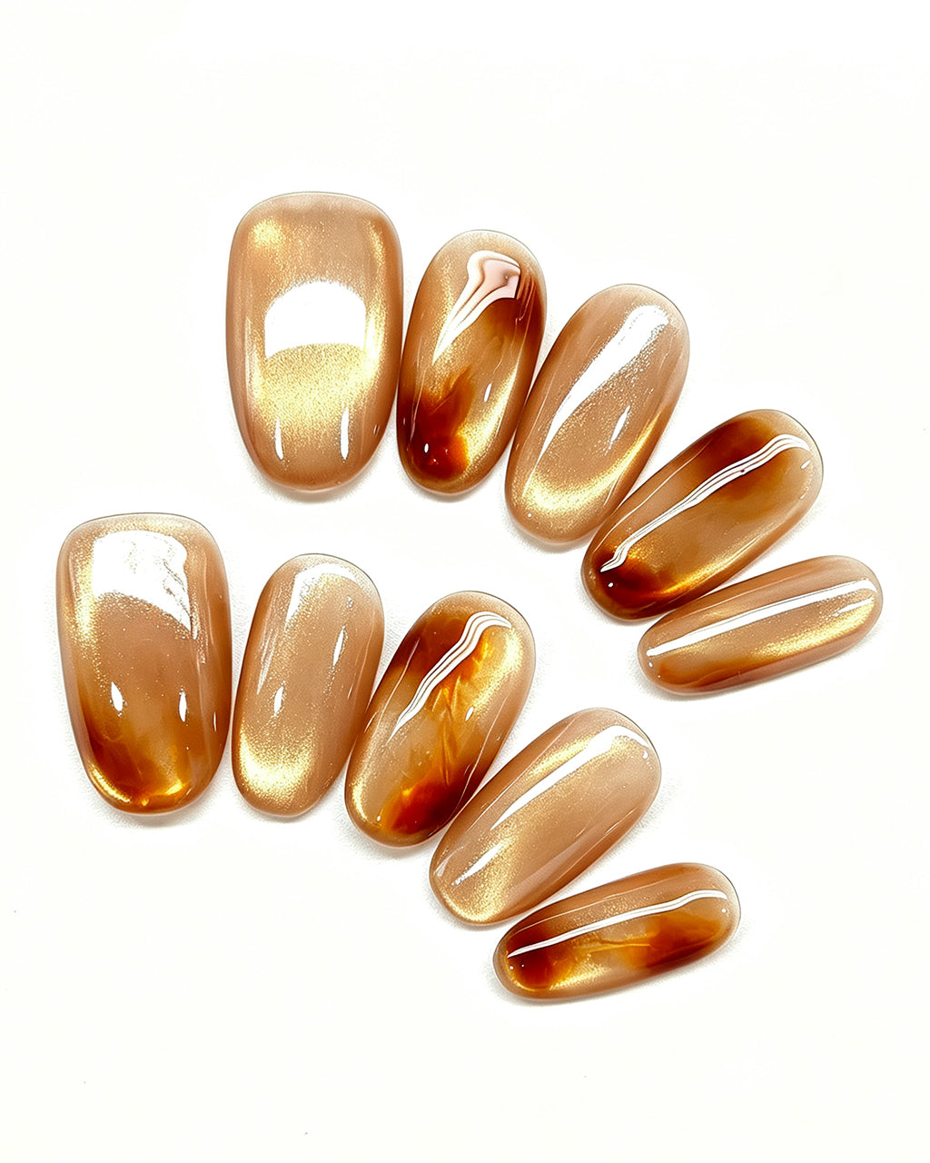 Golden Amber — gold press-on nail set, full set, styled arrangement