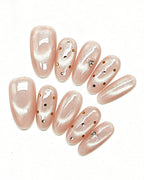 Champagne Dew — gold press-on nail set, full set, styled arrangement