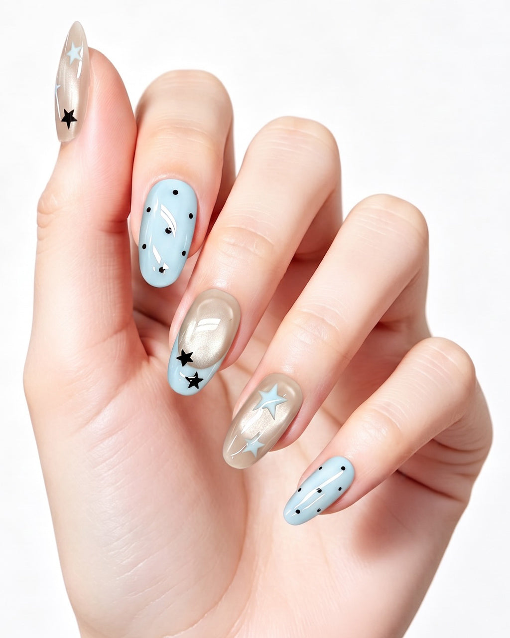 Pastel Blue Star French — press-on nails worn on hand, close view