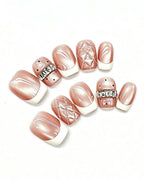 Coquette Glamour | Rose Nude Cat-Eye with 3D Ribbon & Quilte — pink press-on nail set, full set, styled arrangement