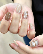 Caramel Latte — press-on nails worn on hand, close view