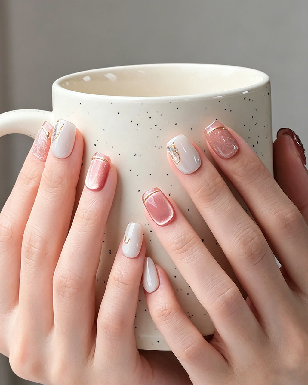 Strawberry Sweetheart — press-on nails worn on hand