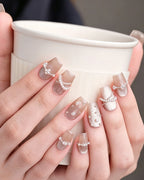 Afloat — press-on nails worn on hand