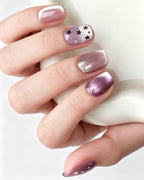 Dusty Rose Cat Eye — press-on nails worn on hand