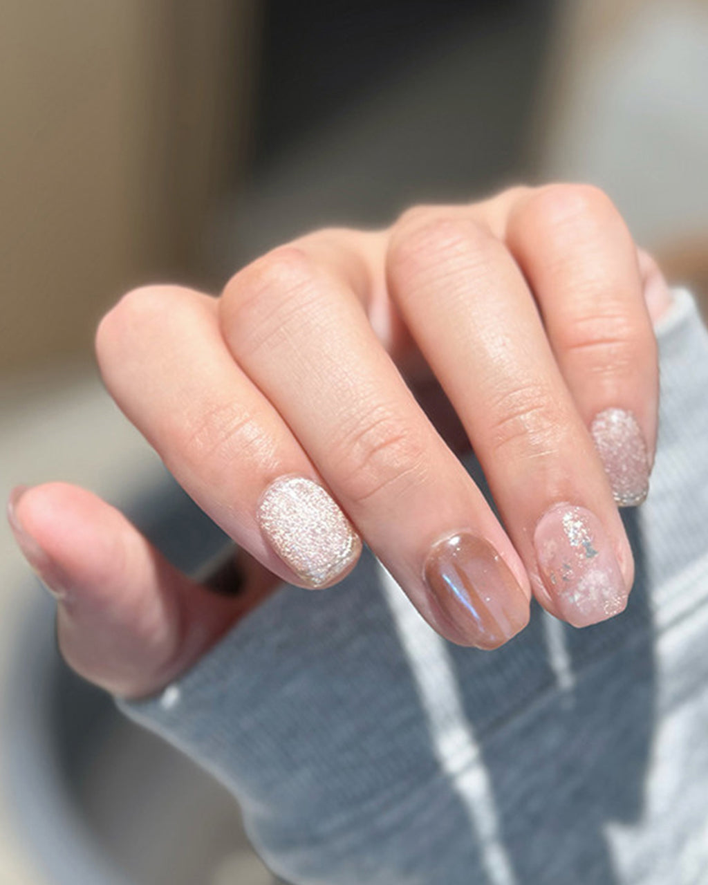 Blossom Peach | Nude Pink Cat Eye & Gold Foil — press-on nails worn on hand