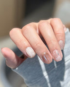 Blossom Peach | Nude Pink Cat Eye & Gold Foil — press-on nails worn on hand