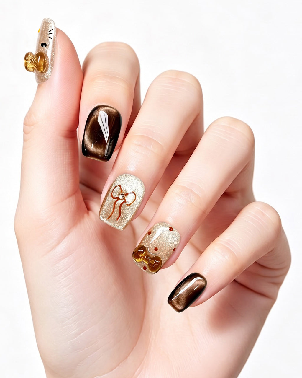 Caramel Brown Cat Eye — press-on nails worn on hand, close view