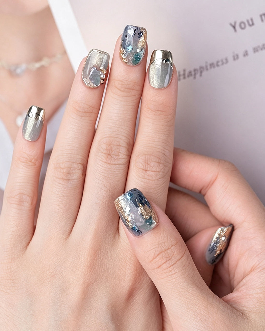 Dew Bubbles | Ice Blue Cat Eye & Chrome French Tip — press-on nails worn on hand