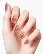Amber Rosewood Jelly — press-on nails worn on hand, close view
