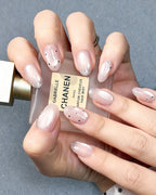 Celestial Stars & Nude Cat-Eye — press-on nails worn on hand, alternate angle