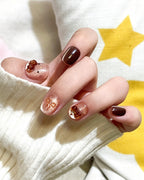 Caramel Brown Cat Eye — press-on nails worn on hand
