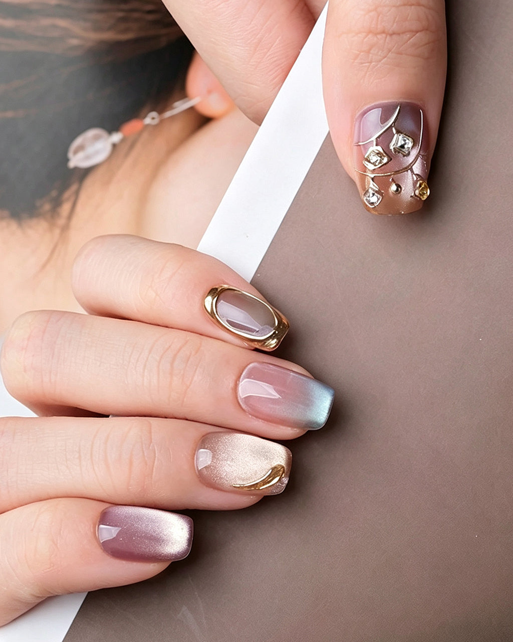 Rhythmic Light — press-on nails worn on hand
