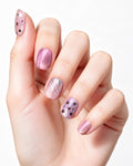Dusty Rose Cat Eye — press-on nails worn on hand, close view