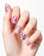 Dusty Rose Cat Eye — press-on nails worn on hand, close view
