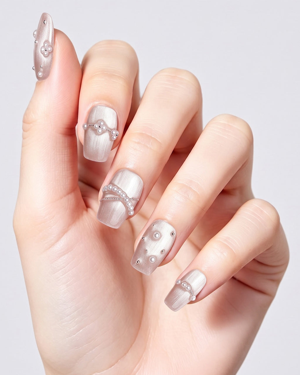 Afloat — press-on nails worn on hand, close view