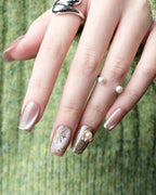 Champagne Gold Cat Eye — press-on nails worn on hand, alternate angle