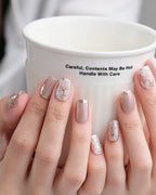 Ice Flower — press-on nails worn on hand, close view