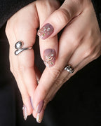 Rhythmic Light — press-on nails worn on hand, close view