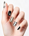 Black and White Tweed — press-on nails worn on hand, close view
