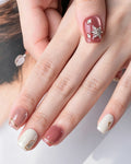 Strawberry Sweetheart — press-on nails worn on hand