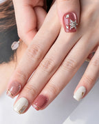 Strawberry Sweetheart — press-on nails worn on hand