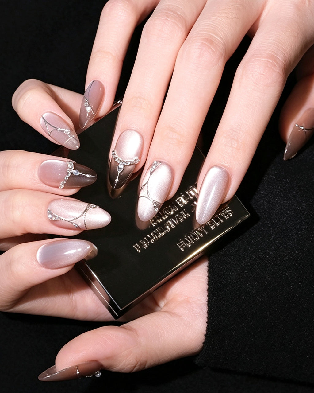 Boiled Water — press-on nails worn on hand