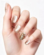 Champagne Gold Cat Eye — press-on nails worn on hand, close view