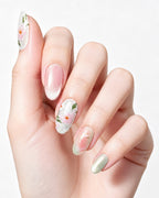 Jasmine Peach — press-on nails worn on hand, close view